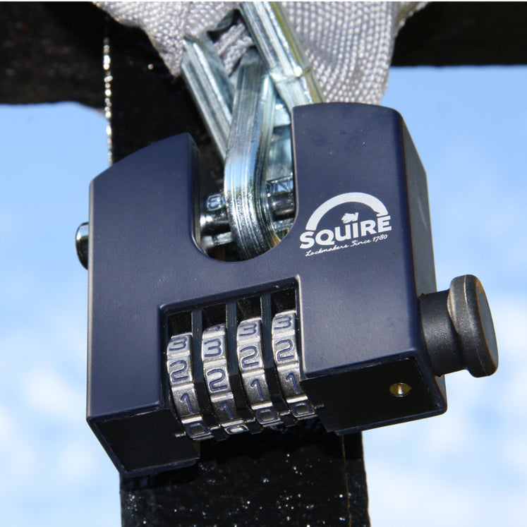 Close-up of combination padlock dials exposed to rain